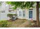 Well-kept townhome with pleasant landscaping, a tidy fenced yard, and a cozy front porch at 300 Gilman Ln # 101, Raleigh, NC 27610