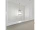 Bright hallway featuring a unique hanging lantern-style pendant light fixture at 300 Gilman Ln # 101, Raleigh, NC 27610