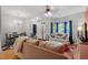 Inviting living space featuring a cozy sofa, large windows with curtains, and a dining area at 300 Gilman Ln # 101, Raleigh, NC 27610