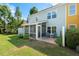 Backyard with patio area, perfect for outdoor dining and entertaining, with a well-manicured lawn at 3002 Bartlett Cir, Hillsborough, NC 27278