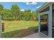 Beautiful backyard view from the covered porch offers a private outdoor retreat with trees and greenery at 3002 Bartlett Cir, Hillsborough, NC 27278