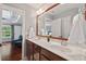 Bathroom featuring double sinks, a large mirror, and access to the shower and toilet at 3002 Bartlett Cir, Hillsborough, NC 27278