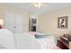 Bright bedroom featuring wood floors, a ceiling fan, and natural light at 3002 Bartlett Cir, Hillsborough, NC 27278
