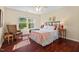 Relaxing bedroom with neutral tones, wood floors and lots of natural light at 3002 Bartlett Cir, Hillsborough, NC 27278