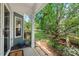 Welcoming front porch with a stone walkway, landscaped garden, and a peek of the expansive yard at 3002 Bartlett Cir, Hillsborough, NC 27278
