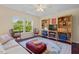 Cozy living room with dark wood floors, a decorative rug and natural light at 3002 Bartlett Cir, Hillsborough, NC 27278