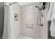 Clean shower with white tiles, a handheld shower head, and a built-in niche for storage at 3002 Bartlett Cir, Hillsborough, NC 27278