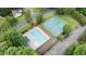 Aerial view showcasing a community pool, tennis courts and lush landscaping at 3016 Bolo Trl, Raleigh, NC 27615