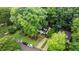 Aerial view of the home showcasing its location on a tree-lined street with well-maintained landscaping at 3016 Bolo Trl, Raleigh, NC 27615