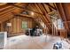 Spacious unfinished attic with exposed beams, offering potential for a customized living area or storage at 3016 Bolo Trl, Raleigh, NC 27615