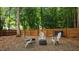 Cozy backyard features a charming fire pit with comfortable seating and a privacy fence at 3016 Bolo Trl, Raleigh, NC 27615