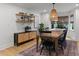Dining room featuring modern decor, wood table, and stylish light fixture at 3016 Bolo Trl, Raleigh, NC 27615
