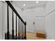 Welcoming foyer featuring a wood floor, wainscotting and black accents on the staircase at 3016 Bolo Trl, Raleigh, NC 27615