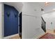 Inviting entryway features wood flooring, blue accent wall, white wainscoting, and leads to the staircase at 3016 Bolo Trl, Raleigh, NC 27615