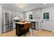 Bright kitchen featuring stainless appliances, a center island and eat in counter space at 3016 Bolo Trl, Raleigh, NC 27615