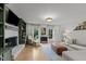 Bright living room showcasing built-in shelving, a fireplace and hardwood floors at 3016 Bolo Trl, Raleigh, NC 27615