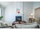 Living room with fireplace and decorative mantel, carpet, and furniture at 3016 Hayling Dr, Raleigh, NC 27610