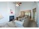 Bright living room featuring a fireplace and open view to the dining area at 3016 Hayling Dr, Raleigh, NC 27610