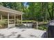 Backyard with a fire pit, screened porch, and a deck provides a perfect blend of indoor-outdoor living at 305 Old School Rd, Chapel Hill, NC 27516