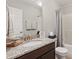 Bathroom featuring granite countertop vanity, a shower/tub combo, and neutral color tones at 305 Old School Rd, Chapel Hill, NC 27516