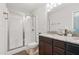 Bathroom with a glass-enclosed shower, granite countertop vanity, and tile floors at 305 Old School Rd, Chapel Hill, NC 27516
