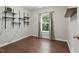 Minimalist bedroom with hardwood floors, a window, and modern shelving at 305 Old School Rd, Chapel Hill, NC 27516