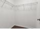 Empty walk-in closet featuring wire shelving and hardwood floors at 305 Old School Rd, Chapel Hill, NC 27516