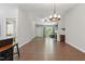 Spacious living room area with hardwood floors, a fireplace, and natural light from the window at 305 Old School Rd, Chapel Hill, NC 27516