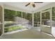 Screened porch overlooking outdoor patio, fire pit, and wooded backyard at 305 Old School Rd, Chapel Hill, NC 27516