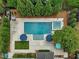 Aerial view showcases a large pool, green landscaping, and expansive outdoor living space at 305 Springtree Circle Cir, Fuquay Varina, NC 27526