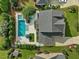 Aerial view features a large pool, lush landscaping, and an expansive driveway at 305 Springtree Circle Cir, Fuquay Varina, NC 27526