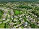 Expansive aerial view of a lush neighborhood with mature trees and well-maintained homes, showcasing a vibrant community at 305 Springtree Circle Cir, Fuquay Varina, NC 27526