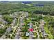 Scenic aerial view of a beautiful community with homes, community pools, nearby lakes and lush green surroundings at 305 Springtree Circle Cir, Fuquay Varina, NC 27526