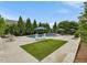 Backyard features a pool, lounge chairs, and manicured landscaping creating a private oasis at 305 Springtree Circle Cir, Fuquay Varina, NC 27526