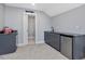 Bar area including cabinets, countertops, sink, refrigerator, and access to a separate room at 305 Springtree Circle Cir, Fuquay Varina, NC 27526