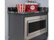 Bar area with a built-in microwave, counter space, and decorations to create a stylish and inviting space at 305 Springtree Circle Cir, Fuquay Varina, NC 27526