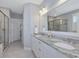 A bathroom featuring double sinks, granite countertop and a glass enclosed shower stall at 305 Springtree Circle Cir, Fuquay Varina, NC 27526