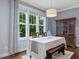 Bright dining room with a large window and a classic wooden hutch at 305 Springtree Circle Cir, Fuquay Varina, NC 27526