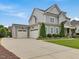 Charming two-story home with three-car garage and well-manicured front yard at 305 Springtree Circle Cir, Fuquay Varina, NC 27526