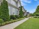 Beautiful two-story home with well-manicured front yard and landscaped walkway at 305 Springtree Circle Cir, Fuquay Varina, NC 27526