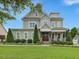 Charming two-story home featuring a landscaped yard and a welcoming front porch, and gray siding at 305 Springtree Circle Cir, Fuquay Varina, NC 27526