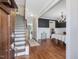 Open foyer with hardwood floors, staircase, dining room, and elegant chandelier at 305 Springtree Circle Cir, Fuquay Varina, NC 27526