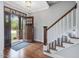 Inviting foyer with hardwood floors, staircase and view of the outdoors at 305 Springtree Circle Cir, Fuquay Varina, NC 27526