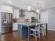 Well-equipped kitchen with stainless steel appliances and a large island at 305 Springtree Circle Cir, Fuquay Varina, NC 27526