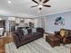 Open-concept living room, seamlessly connecting the living area with the modern kitchen at 305 Springtree Circle Cir, Fuquay Varina, NC 27526
