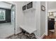 Mudroom area with cubbies, coat hooks, bench and shoe storage, provides organization when entering the home at 305 Springtree Circle Cir, Fuquay Varina, NC 27526