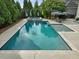 Sparkling pool with a spa area, perfect for relaxing and entertaining in your private backyard at 305 Springtree Circle Cir, Fuquay Varina, NC 27526