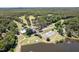 Overhead view featuring a community with a pool, tennis courts, and golf course surrounded by a scenic lake at 307 Country Club Dr, Durham, NC 27712