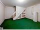 Basement space with stairs, shelves, and bright lighting, ready to be customized! at 307 Country Club Dr, Durham, NC 27712
