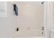 Bathroom with a white tile tub and shower combo with a white shower curtain at 307 Country Club Dr, Durham, NC 27712